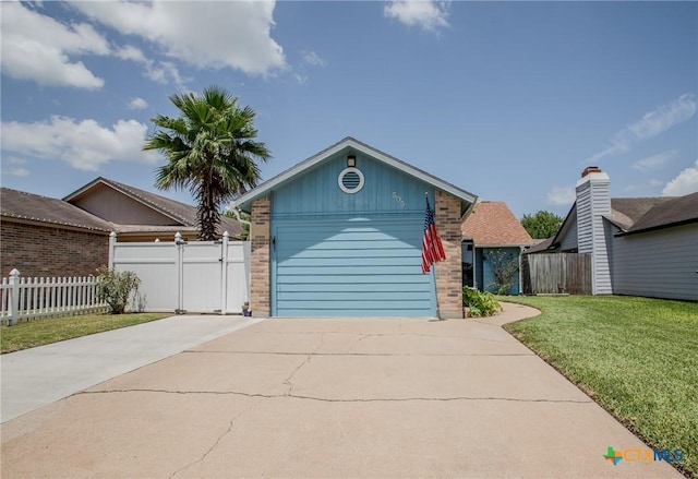505 Cabana Dr, Victoria, TX 77901 - view of front of property featuring brick siding, driveway, and a garage