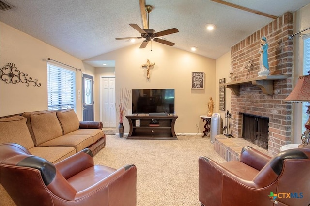 505 Cabana Dr, Victoria, TX 77901 - carpeted living area with vaulted ceiling, ceiling fan, a brick fireplace, and recessed lighting