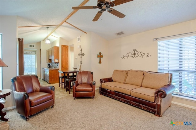 505 Cabana Dr, Victoria, TX 77901 - living area featuring a ceiling fan, light colored carpet, and vaulted ceiling