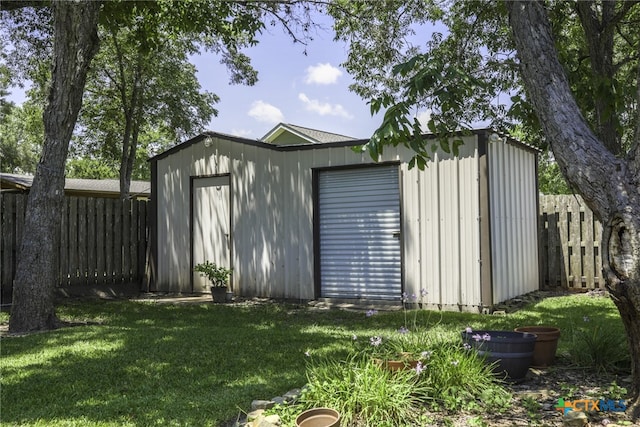 view of outdoor structure featuring a lawn