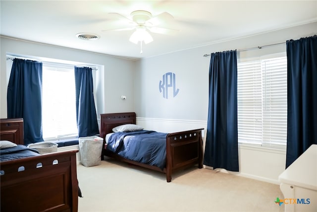 carpeted bedroom with ceiling fan