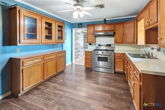 116 N Ben Wilson St, Victoria, TX 77901 - kitchen featuring stainless steel gas stove, under cabinet range hood, ornamental molding, ceiling fan, and brown cabinets
