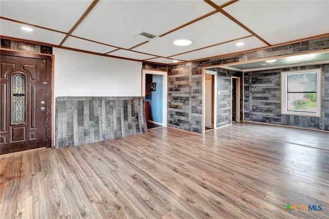 116 N Ben Wilson St, Victoria, TX 77901 - unfurnished living room featuring wooden walls, wood finished floors, and recessed lighting
