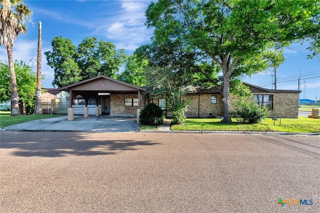 116 N Ben Wilson St, Victoria, TX 77901 - view of front of house with an attached carport