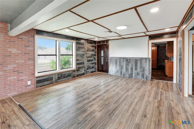 116 N Ben Wilson St, Victoria, TX 77901 - unfurnished living room featuring wood finished floors, a wainscoted wall, and recessed lighting