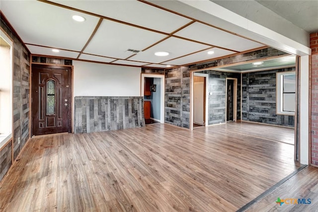 116 N Ben Wilson St, Victoria, TX 77901 - unfurnished living room featuring wood finished floors and wainscoting