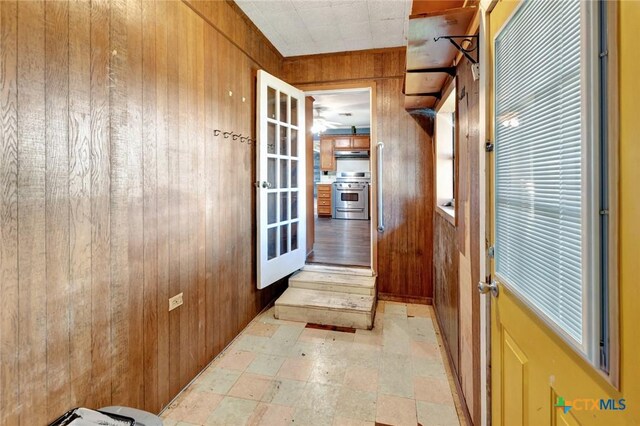 116 N Ben Wilson St, Victoria, TX 77901 - doorway to outside with wooden walls and french doors