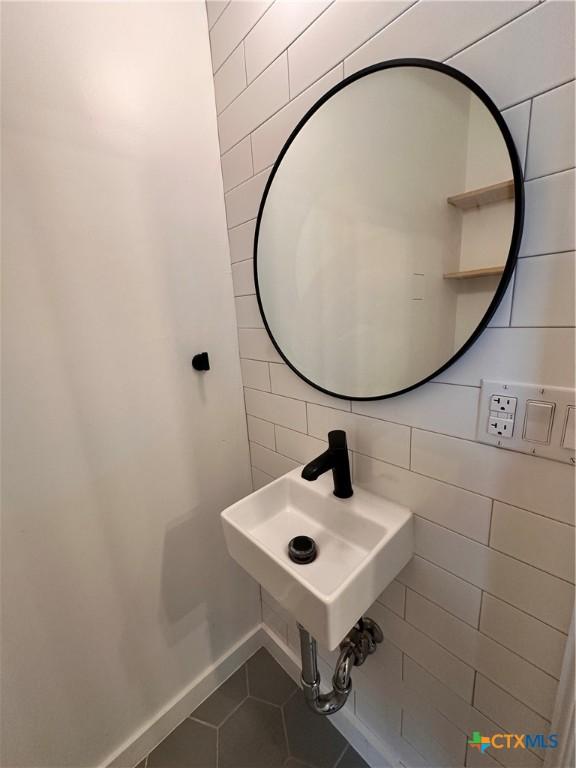 bathroom with tile patterned floors and sink