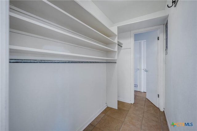 spacious closet with tile patterned flooring