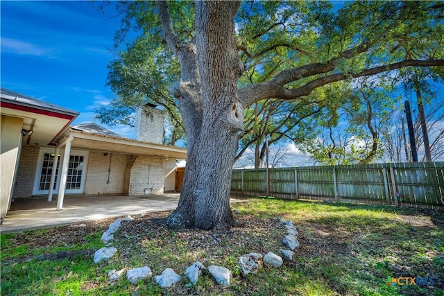 view of yard with a patio and a fenced backyard