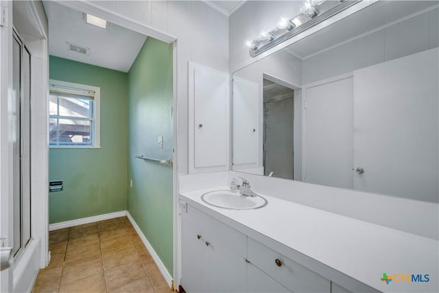 bathroom featuring visible vents, walk in shower, baseboards, tile patterned floors, and vanity