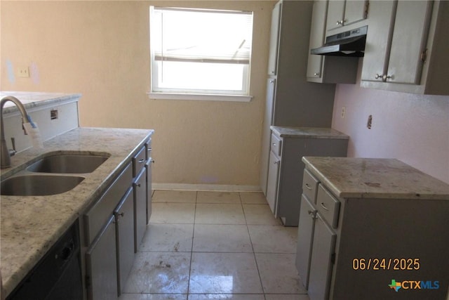 2101 Stagecoach Trl, Temple, TX 76502 - kitchen featuring under cabinet range hood, light stone counters, and light tile patterned floors