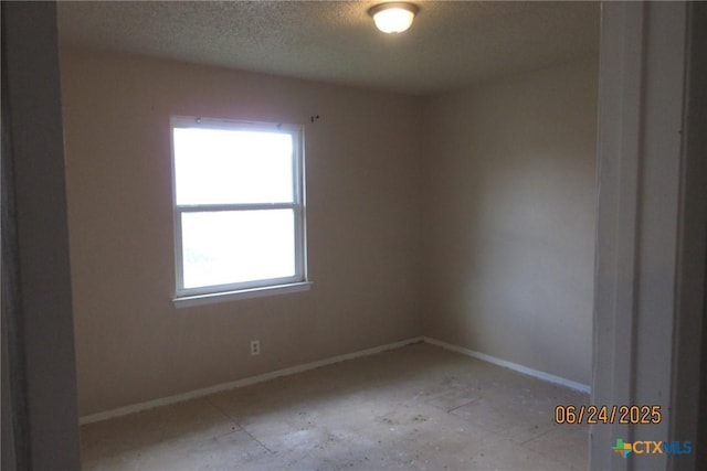 2101 Stagecoach Trl, Temple, TX 76502 - empty room featuring baseboards and a textured ceiling