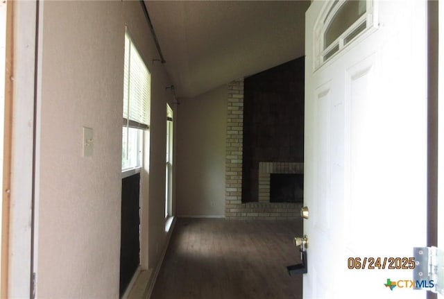 2101 Stagecoach Trl, Temple, TX 76502 - hallway with wood finished floors and vaulted ceiling