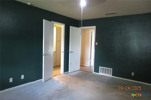2101 Stagecoach Trl, Temple, TX 76502 - spare room with concrete flooring and baseboards