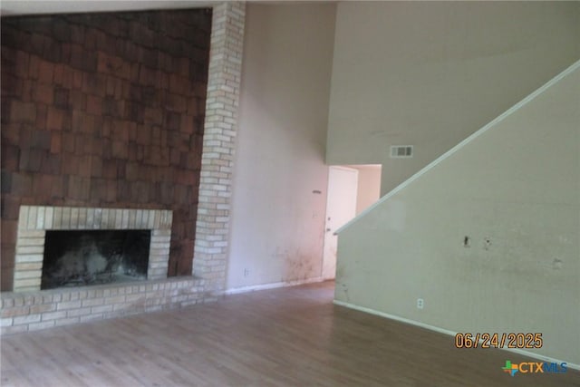 2101 Stagecoach Trl, Temple, TX 76502 - unfurnished living room with wood finished floors and a fireplace