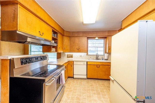 kitchen featuring white appliances and sink