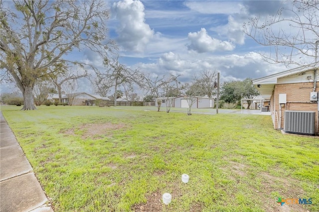 view of yard featuring central AC unit