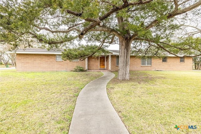 ranch-style home featuring a front yard