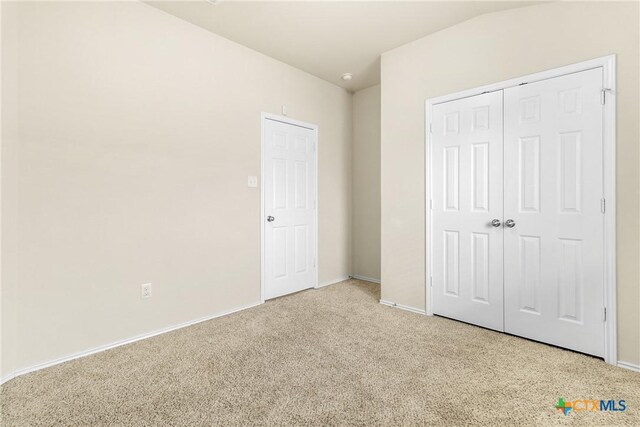 6500 Mustang Creek Rd, Killeen, TX 76549 - unfurnished bedroom with carpet flooring, baseboards, and a closet