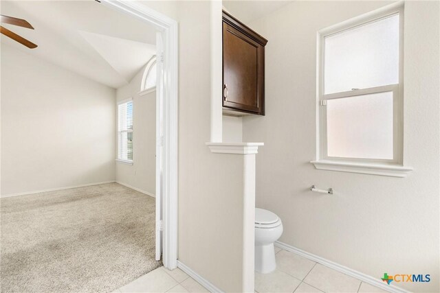 6500 Mustang Creek Rd, Killeen, TX 76549 - bathroom with ceiling fan, baseboards, toilet, lofted ceiling, and tile patterned floors