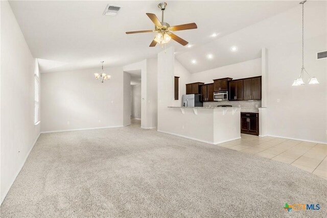6500 Mustang Creek Rd, Killeen, TX 76549 - unfurnished living room featuring vaulted ceiling, a chandelier, light carpet, ceiling fan, and baseboards