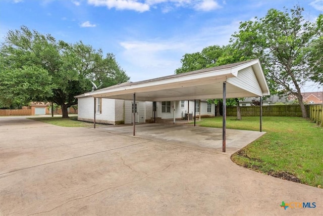 413 S Tyler St, Mcgregor, TX 76657 - view of vehicle parking with a detached carport and concrete driveway