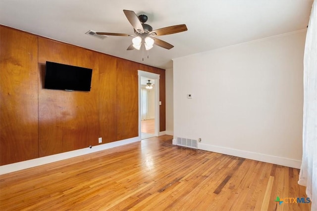 413 S Tyler St, Mcgregor, TX 76657 - spare room with ceiling fan, baseboards, and light wood-style floors