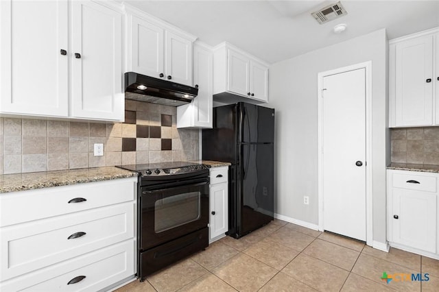 kitchen with white cabinetry, light stone countertops, backsplash, light tile patterned flooring, and black appliances