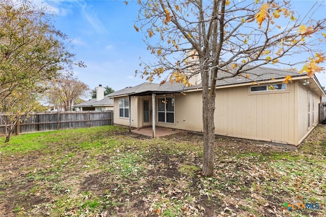 rear view of property featuring a patio area