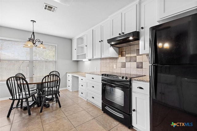 kitchen featuring pendant lighting, black appliances, white cabinets, light tile patterned floors, and a notable chandelier