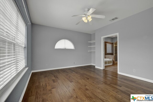 unfurnished room with dark hardwood / wood-style flooring and ceiling fan