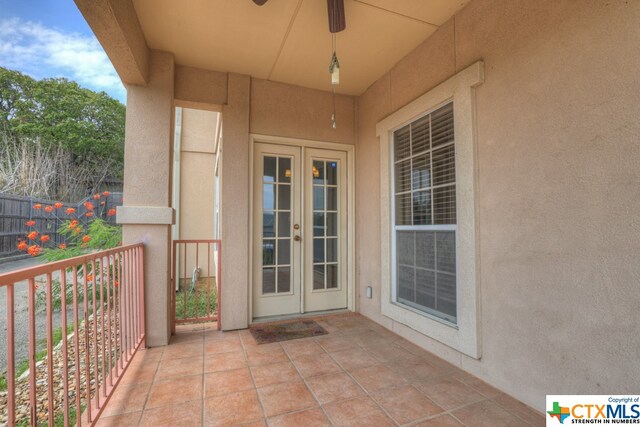 entrance to property with french doors and ceiling fan