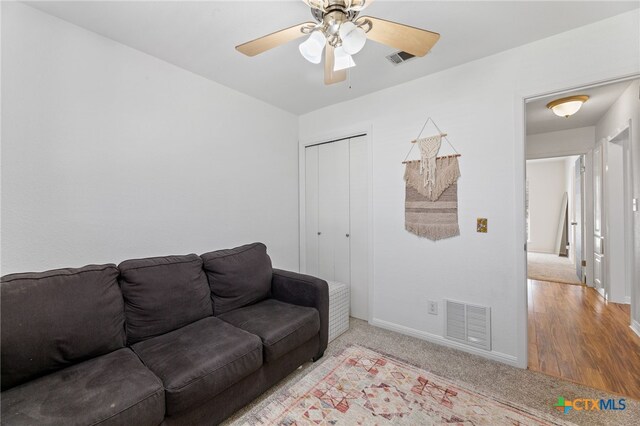 5004 Powder River Rd, Austin, TX 78759 - living room with light carpet, visible vents, baseboards, and a ceiling fan