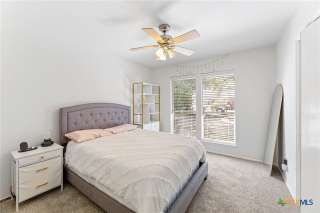 5004 Powder River Rd, Austin, TX 78759 - carpeted bedroom with baseboards and ceiling fan
