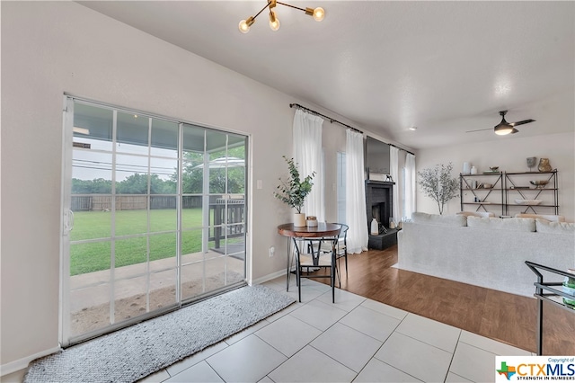 living room with wood-type flooring and ceiling fan