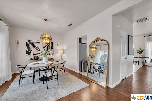 dining space featuring hardwood / wood-style flooring