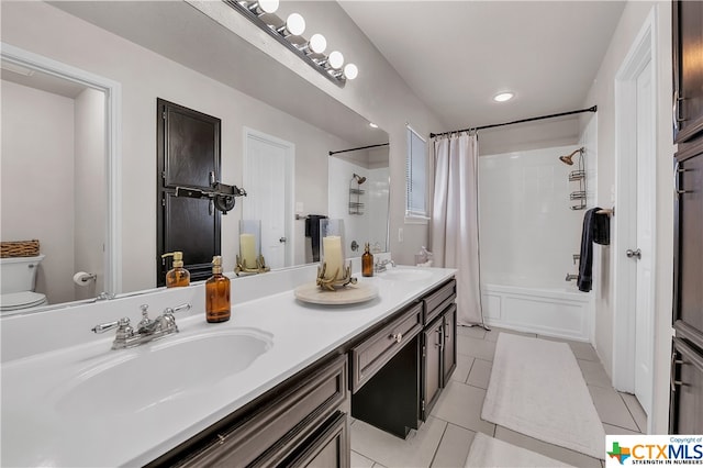 full bathroom featuring tile patterned flooring, vanity, shower / bath combination with curtain, and toilet