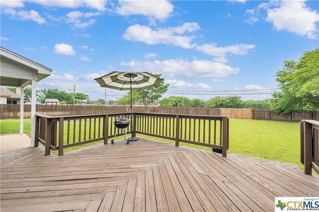 wooden deck with a lawn