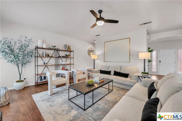 living room with hardwood / wood-style flooring and ceiling fan