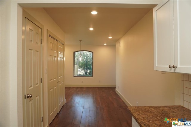 1017/1019 Haynes St Unit 7, San Marcos, TX 78666 - hall with dark wood-style floors, baseboards, and recessed lighting