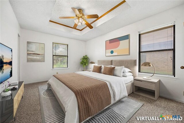 312 Saddle Dr, Copperas Cove, TX 76522 - bedroom featuring carpet, a raised ceiling, a textured ceiling, and a ceiling fan