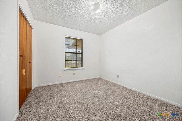 312 Saddle Dr, Copperas Cove, TX 76522 - carpeted spare room featuring a raised ceiling, a textured ceiling, and ceiling fan