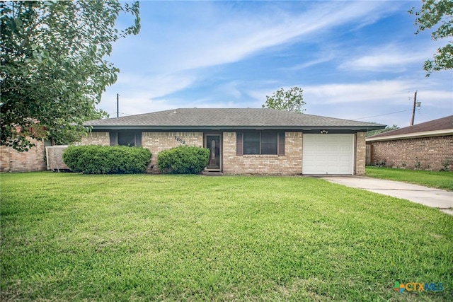 ranch-style house with roof with shingles, brick siding, a garage, a front yard, and driveway