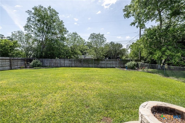 view of yard with a fenced backyard