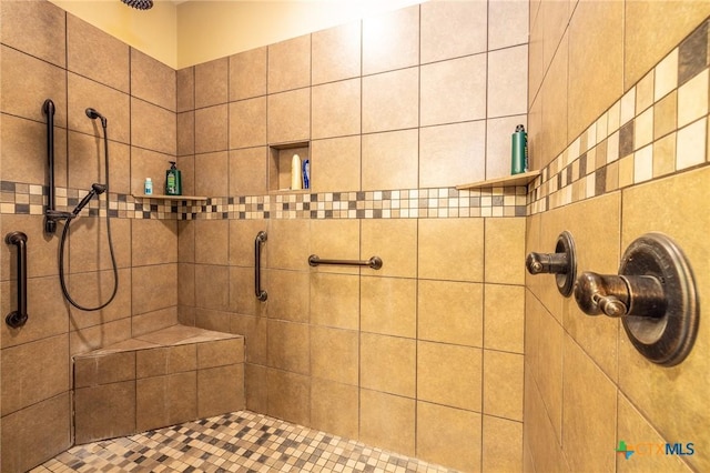 bathroom featuring tiled shower