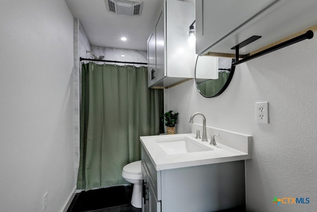 bathroom with vanity, toilet, and a shower with shower curtain