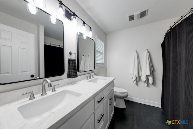 bathroom featuring tile patterned flooring, vanity, a shower with curtain, and toilet