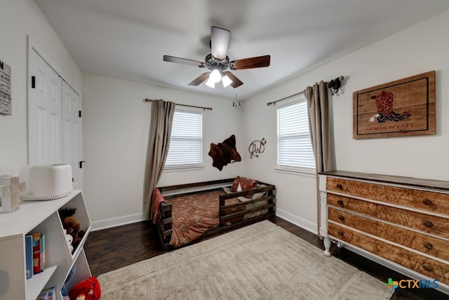 bedroom featuring dark hardwood / wood-style floors and ceiling fan