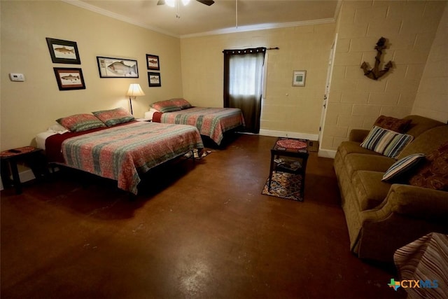 bedroom featuring concrete block wall, crown molding, and concrete flooring